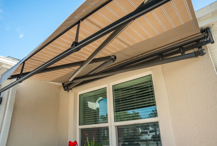 SunPro cross-arm awning SunPro cross-arm retractable awning, partly extended